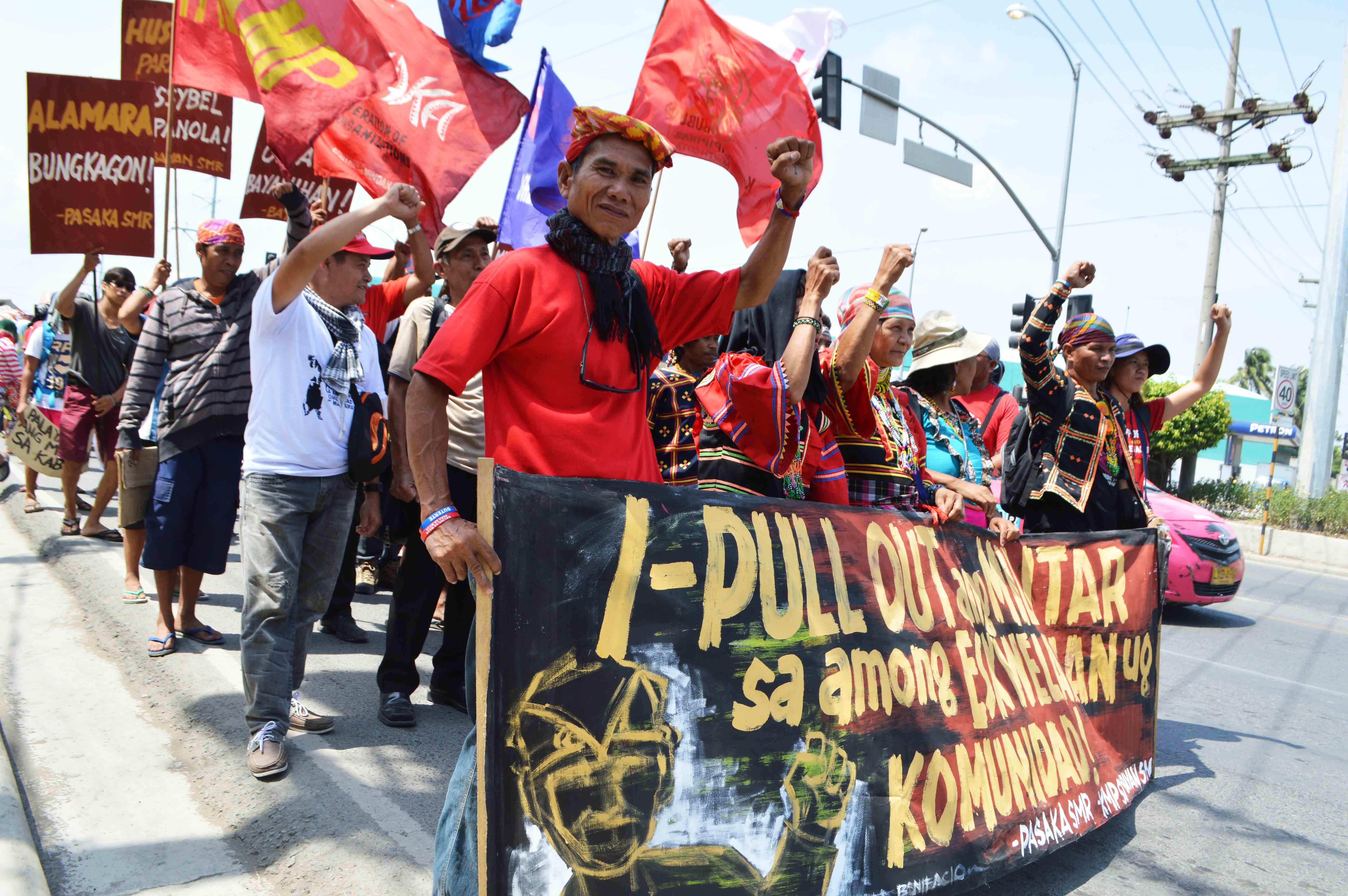 Hundreds of Lumad and farmers gathered in front  of  Eastern Mindanao Command, Camp Panacan in Davao City on Friday morning, August 26 to present their concern regarding militarization of their  communities. The protesters also asked President Rodrigo Roa Duterte to pull out the military from their ancestral lands and to stop Lumads killings. (Medel V. Hernani/davaotoday.com)