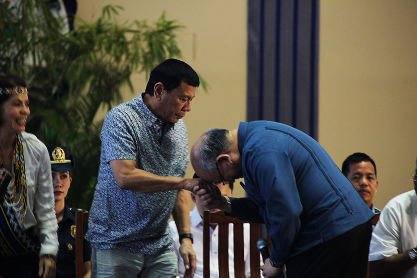 MANO PO. After President Rodrigo Duterte placed his head on the priest's hand as a sign of respect, Ateneo de Davao University President Fr. Joel Tabora S.J., repeats the gesture after Duterte's speech in the Mindanao Environmental Summit 2016 dubbed, "Oya Mindanao!" at the Ateneo de Davao University on Thursday afternoon, August 4. (Paulo C. Rizal/davaotoday.com)