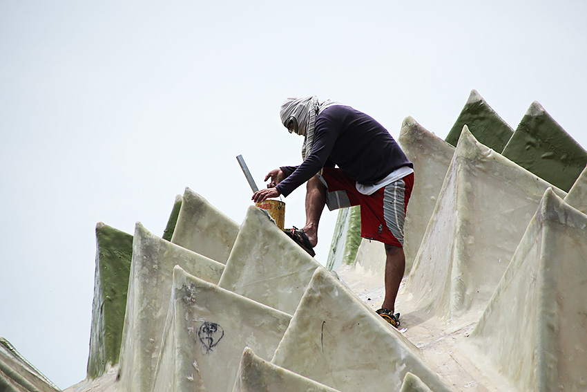 Workers paint the exterior of the Durian Dome at the People's Park as part its renovation in time for the Kadayawan Festival. (Paulo C. Rizal/davaotoday.com)