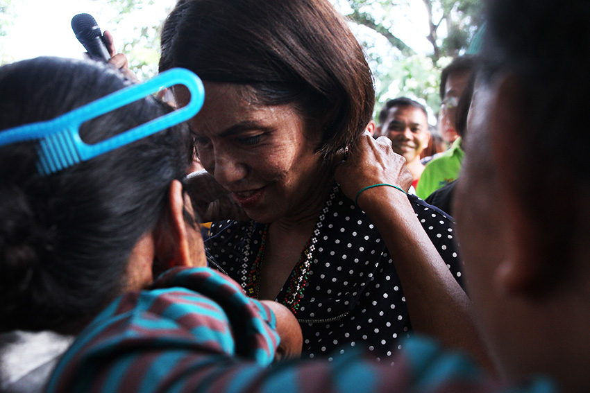 Environment and Natural Resources Secretary Gina Lopez receives a necklace from a Lumad woman during her visit at the United Church of Christ in the Philippines Haran compound, in Father Selga Street, Davao City, on Friday, August 5. The church compound remains a sanctuary for more than 300 indigenous people's evacuees who were displaced due to alleged harassment and threats from paramilitary groups and soldiers. (Paulo C. Rizal/davaotoday.com)