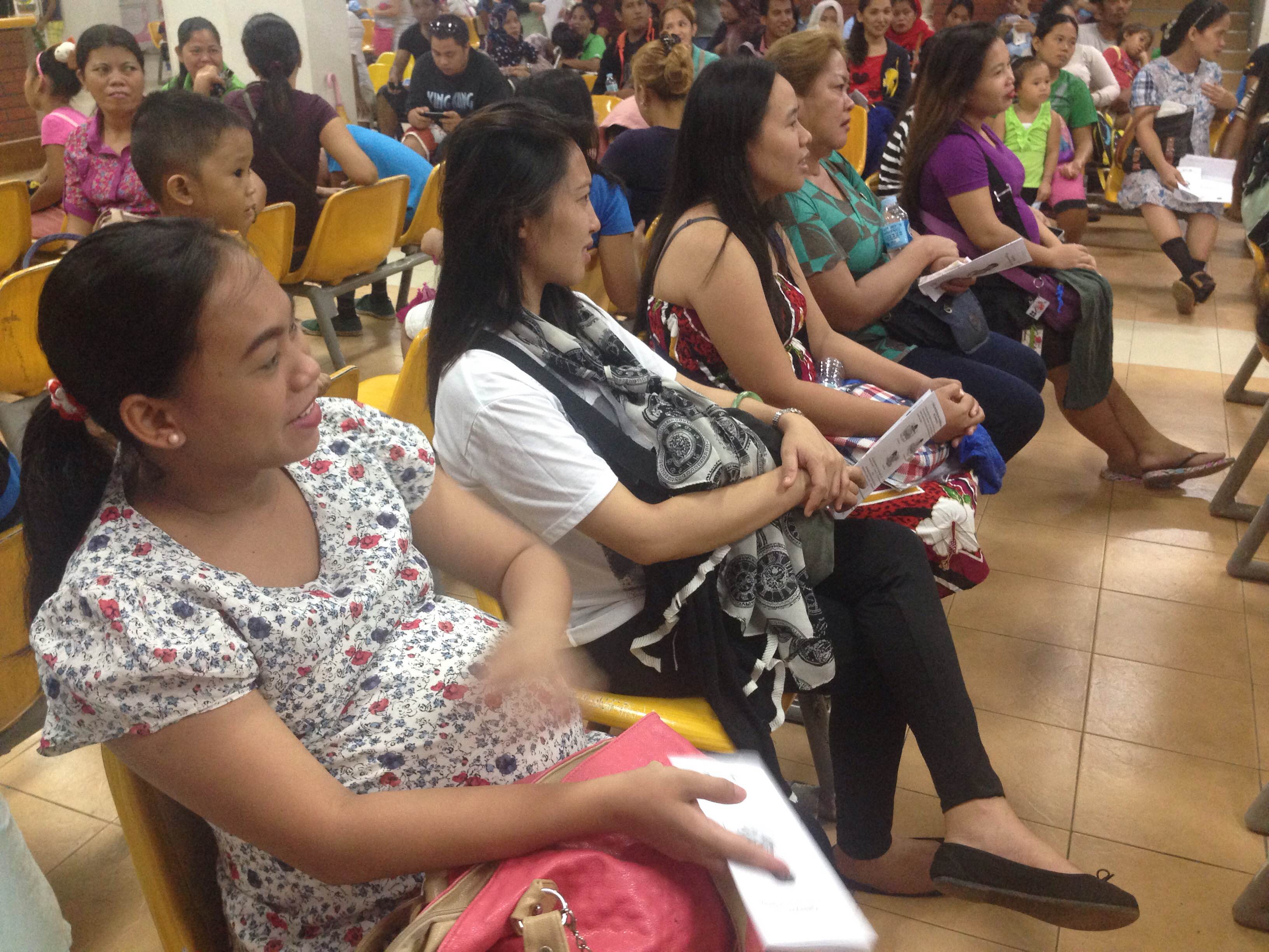 While waiting for their turn for their prenatal check up, mothers at the Southern Philippines Medical Center in Davao City listen to the discussion on breastfeeding myths by a counselor from LATCH Davao, a breastfeeding support group. (Zea Io Ming C. Capistrano/davaotoday.com)