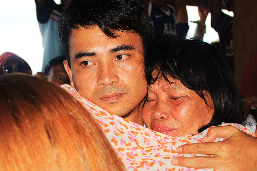 EMOTIONAL. PO3 Jayroll Bagayas, one of the four political prisoners of the New People's Army in Surigao City, is emotional upon meeting his family.