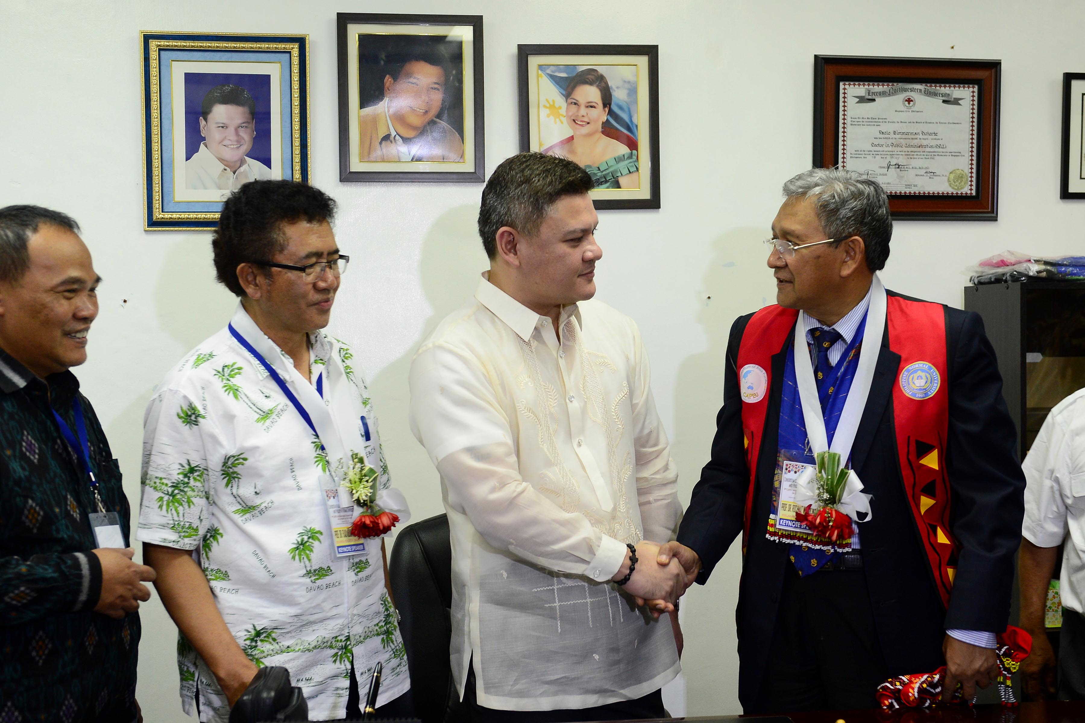 Vice Mayor Paolo Duterte shakes hands with Dr. Rochmat Wahab of Karangmalang, Yogyakarta, Indonesia, as he received the members of the Association of Southeast Asian Nations Tuesday., August 30. Davao City will host the 3-day Japan-Asean environmental forum on August 31 to September 2. (City Information Office)