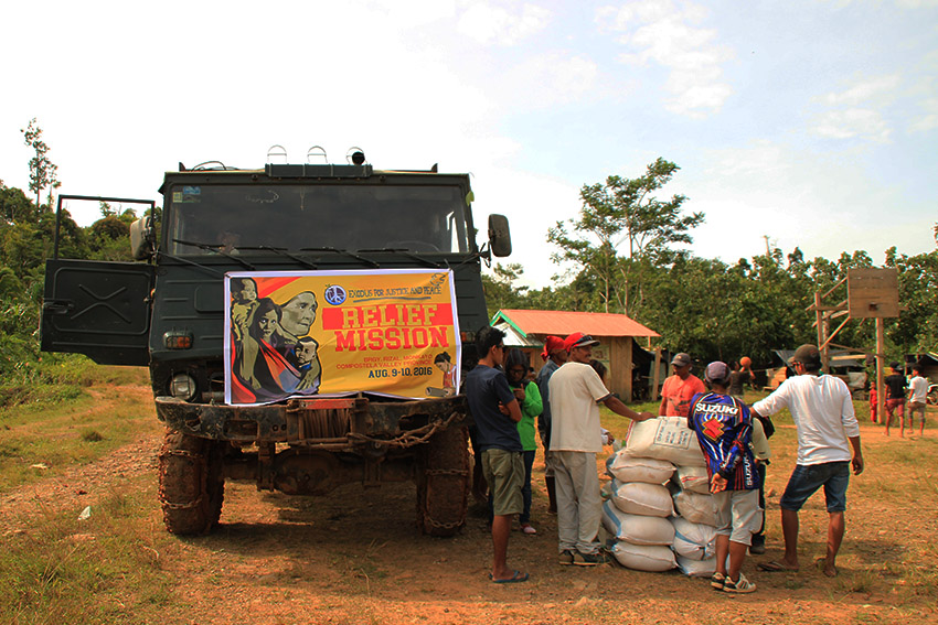 RELIEF MISSION. About 50 delegates of the relief mission, on board two trucks with food aids, travel some 7 kilometers to reach the community of Purok 4, Barangay Rizal in Monkayo, Compostela Valley province. (Earl O. Condeza/davaotoday.com)