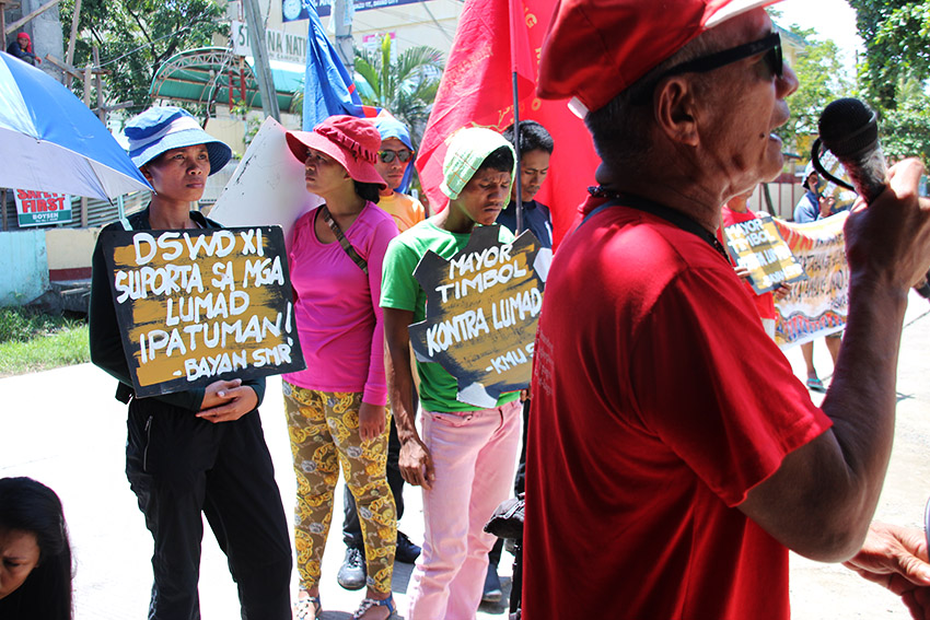 WHERE'S THE AID? Lito Lao (right), vice chairman of the Kilusang Magbubukid ng Pilipinas Farmers, speaks during a rally in front of the Department of Social Welfare and Development  Region 11 Office in Davao City on Thursday, September 15 to remind the agency of their promise to aid the Lumad evacuees staying at the UCCP Haran compound.(Paulo C. Rizal/davaotoday.com)