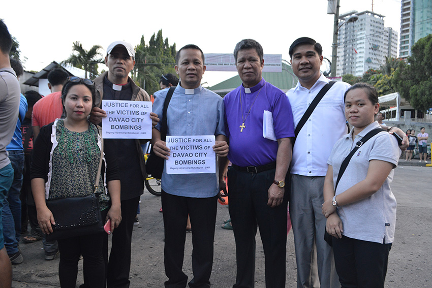 United Church of Christ Bishop Hamuel G. Tequis (4th from left) condemns the incident and urge Davao City residents to be vigilant at these times.