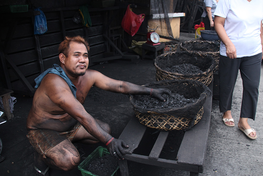 Workers like Casipi risk having pulmonary ailments as they can breathe in fine charcoal dust. They also face the danger of fire accidents that come with the goods that they sell. (Paulo C. Rizal/davaotoday.com)