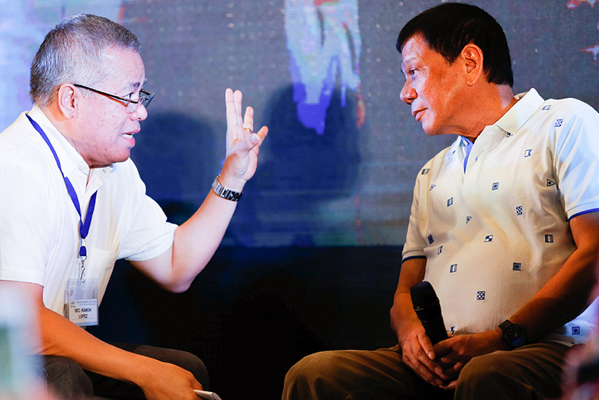 President Rodrigo Duterte listens to Trade Secretary Ramon Lopez during a conversation at the launching of "Go Negosyo Mentor Me” program of the Department of Trade and Industry at the Marco Polo Hotel in Davao City on October 7, 2016. (TOTO LOZANO/PPD)