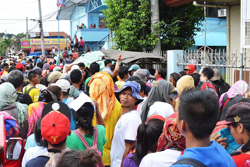 Thousands of farmers, mostly indigenous peoples, in Southern Mindanao march to the Department of Social Work and Development Office (DSWD) in Davao City on Wednesday morning, Oct. 26 to demand the release of their calamity fund in the aftermath of the long dry spell in 2015 toward summer of this year. They march back to their temporary shelter in barangay Barangay 5-A Bankerohan Gym here. (Medel V. Hernani/davaotoday.com)