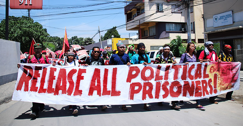 Farmers and Lumad march from the  the National Commission for Indigenous Peoples Region XI office to the Benigno S. Aquino Hall of Justice in Ecoland, here to call for the release of political prisoners and the dismissal of "trumped up" charges against them on Wednesday morning, August 24. (Paulo C. Rizal/davaotoday.com)