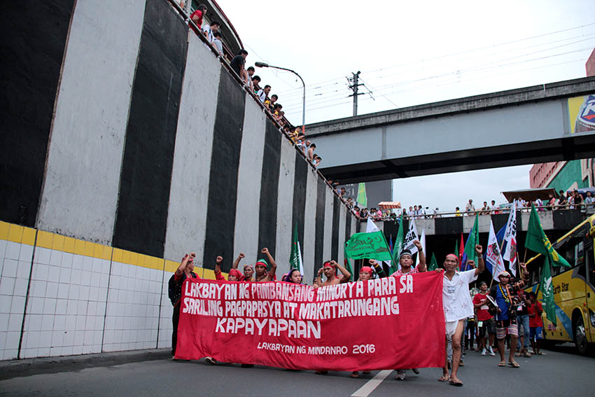 MARCH FORWARD. Contingents of Mindanao Lakbayan are joined by their counterparts from Visayas and Southern Luzon as they march onward to Cordillera for the "Grand Salubongan" in Mendiola on Oct. 13.