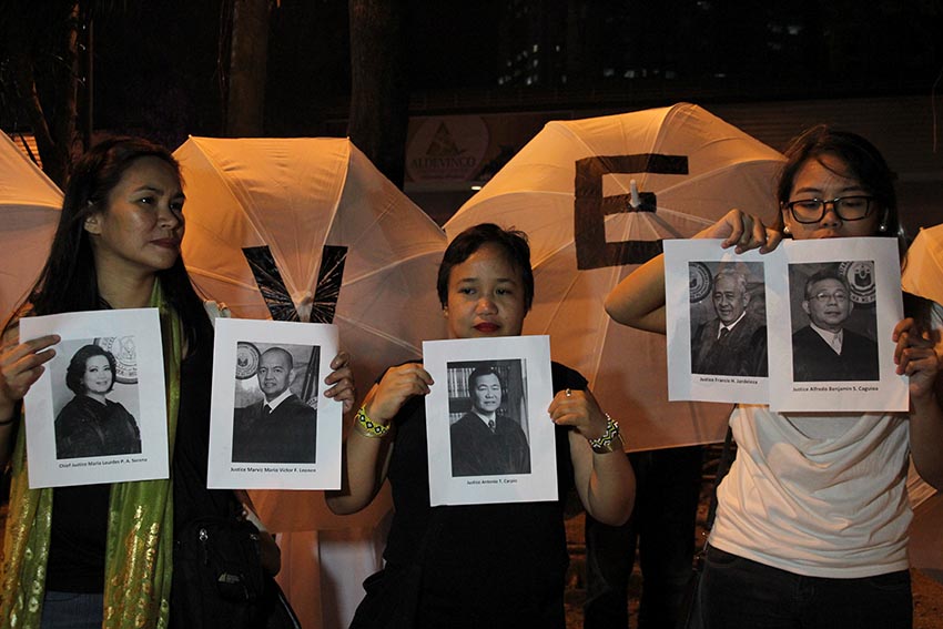 Members of Konsensya Dabaw, a local movement opposing the hero's burial for former President Ferdinand Marcos, hold portraits of the five judges who voted against the burial of Marcos at the Libingan ng mga Bayani during their indignation rally Tuesday, Nov.8 following the high court's ruling of allowing Marcos burial at LNMB. The five judges include Chief Justice Maria Lourdes Sereno, Senior Justice Antonio Carpio, Justice Marvic Leonen, and Justice Alfredo Benjamin Caguioa. (Paulo C. Rizal/davaotoday.com)
