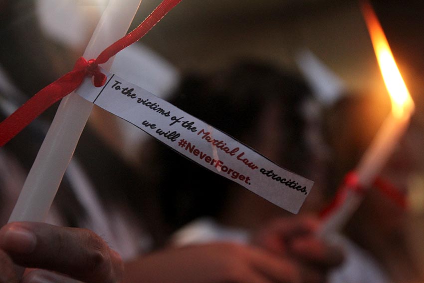 YOUTH VS MARTIAL LAW.  Students of the Ateneo de Davao University light candles on Monday, Nov. 21 to condemn the hero's burial of the former president Ferdinand Marcos.  (Paulo C. Rizal/davaotoday.com) 