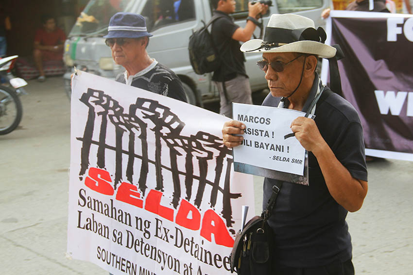 Survivors of Martial Law march together with other Dabawenyos as they tag Marcos as a fascist and not a hero. (Earl O. Condeza/davaotoday.com)