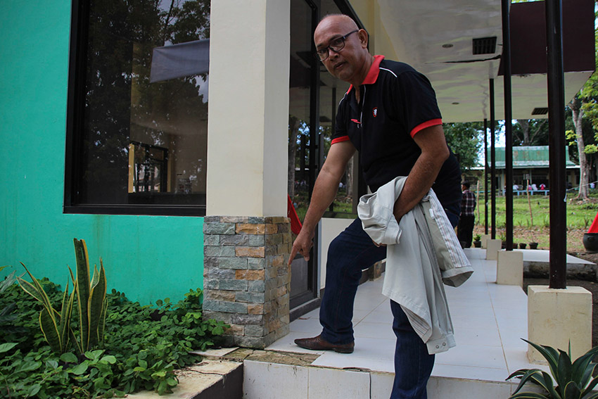 BRAND NEW CRACKS. Dr. Harris Sinolinding, a professor from the Cotabato Foundation College of Science and Technology points to a cracked floor of the Biological Sciences Lab, one of the school's newest facilities that had the budget of P2.234 million. Substandard construction of the facilities in the school is one of the corruption allegations that school president Dr. Samson Molao is facing from at least 600 farmers, students, and faculty who have set up a protest camp inside the school grounds in Brgy. Doroluman, Arakan, North Cotabato. (Paulo C. Rizal/davaotoday.com) 