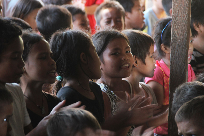 In preparation for their Christmas party this Dec. 10, Lumad students practice singing Christmas songs after their regular class at the United Church of Christ in the Philippines Haran compound where Lumad evacuees are currently staying. (Earl O. Condeza/davaotoday.com)  