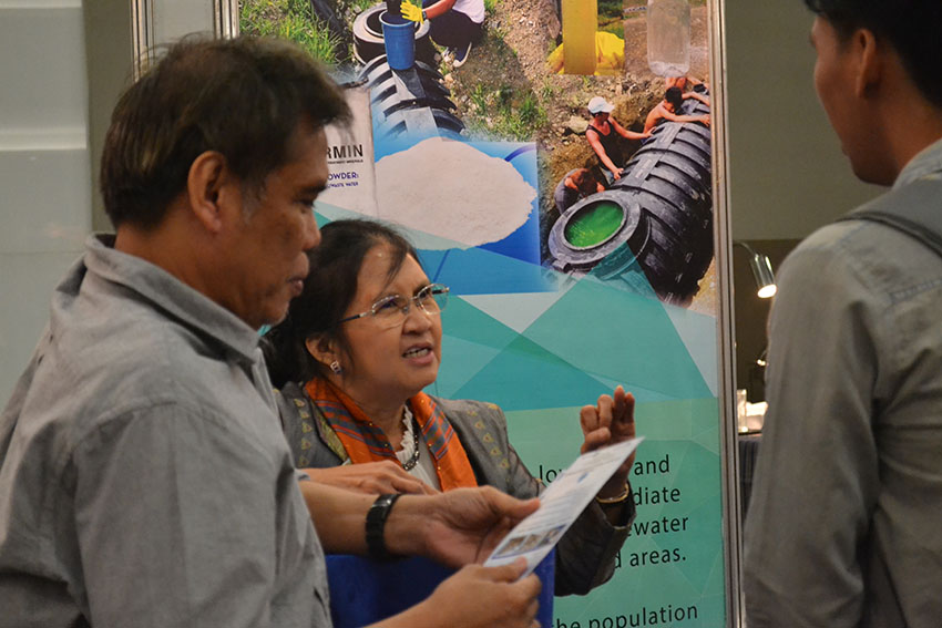 WATER TREATMENT. Merlinda A. Palencia, a professor from Adamson University, explains the benefits of "Virgomin" to both humans and the environment. Virgomin, an eco-friendly septic water treatment, is one of the products and technologies exhibited on Tuesday, Dec. 13, during the Mindanao-wide Technology Transfer Day held at the SMX Convention Center in Davao City. (Robby Joy Salveron/davaotoday.com)