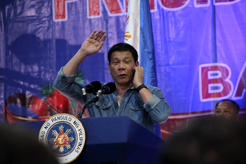 President Rodrigo Duterte speaks before local officials in Davao City during the Christmas party for barangay officials held at the Davao Recreation Center on Tuesday night, Dec. 27. (Paulo C. Rizal/davaotoday.com)