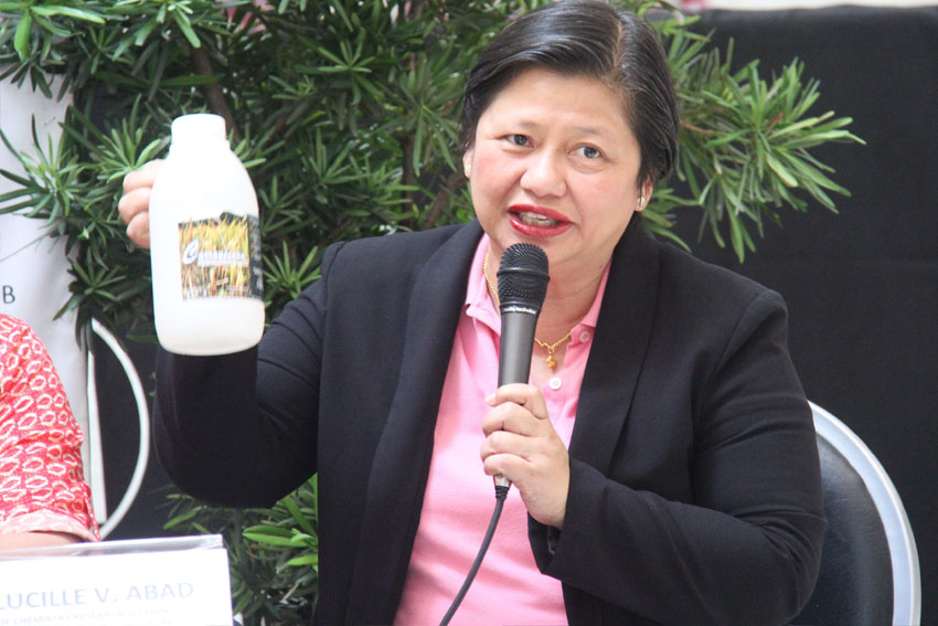 Dr. Lucille V. Abad, head of Chemistry Research Section of the Philippine Nuclear Research,  presents a bottle of their newly developed product called “Carageenan” which is used as plant food supplement for rice and other plants.  Carageenan and other new technologies will be exhibited on Tuesday, Dec. 13 during the Mindanao-wide Technology Transfer Day organized by the Department of Science and Technology. (Maricar Emata/davaotoday.com)