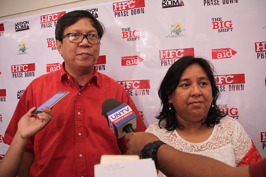 ENVIRONMENTALISTS. Renewable energy advocates Engr. Melvin Purzuelo, National Coordinator of Aksyon Klima Pilipinas (left) and Jessica Dator-Bercilla, Senior Advocacy and Policy Officer for Asia and the Middle East of Christian Aid (right) call for more public awareness regarding the dangers of Hydroflourocarbons, a type of greenhouse gas that was used as an alternative to Chloroflourocarbons, but causes bigger problem in the environment. Their groups held a forum at the Marco Polo Hotel in Davao City on Wednesday, Dec. 28. (Paulo C. Rizal/davaotoday.com) 