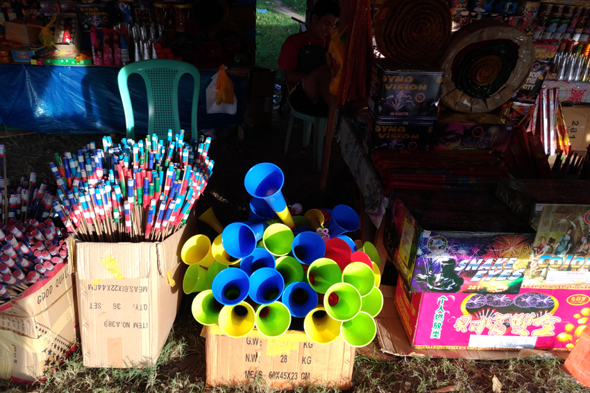 Venders of fireacrackers and party horns along the national highway in Digos City admit that sale has declined as buyers choose the safer party horns to welcome the New Year. (Zea Io Ming C. Capistrano/davaotoday.com)