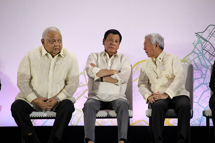 (L-R) Executive Secretary Salvador Medialdea, President Rodrigo Duterte, and Foreign Affairs Secretary Perfecto Yasay, Jr. during the Launch of the Philippine Chairmanship to the ASEAN 2017 at the SMX Convention Center in Lanang, Davao City on Sunday, Jan. 15, 2017. (Paulo C. Rizal/davaotoday.com) 