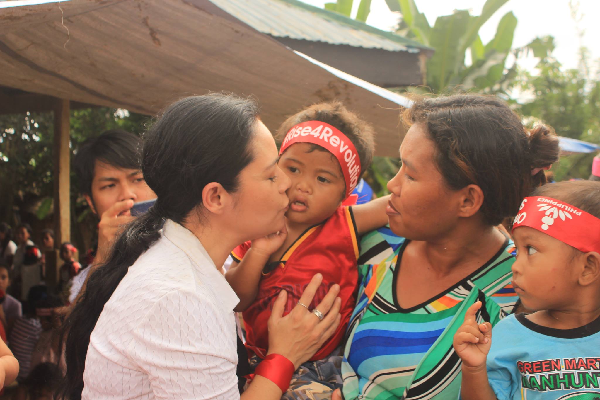 ADVOCACY. Filipino actress Monique Wilson kisses a Matigsalug child during her visit in Barangay Cabalantian in Kitaotao, Bukidnon province on Sunday, Jan. 8 for the One Billion Rising global movement to end violence against women. (Photo by Kilab Multimedia)