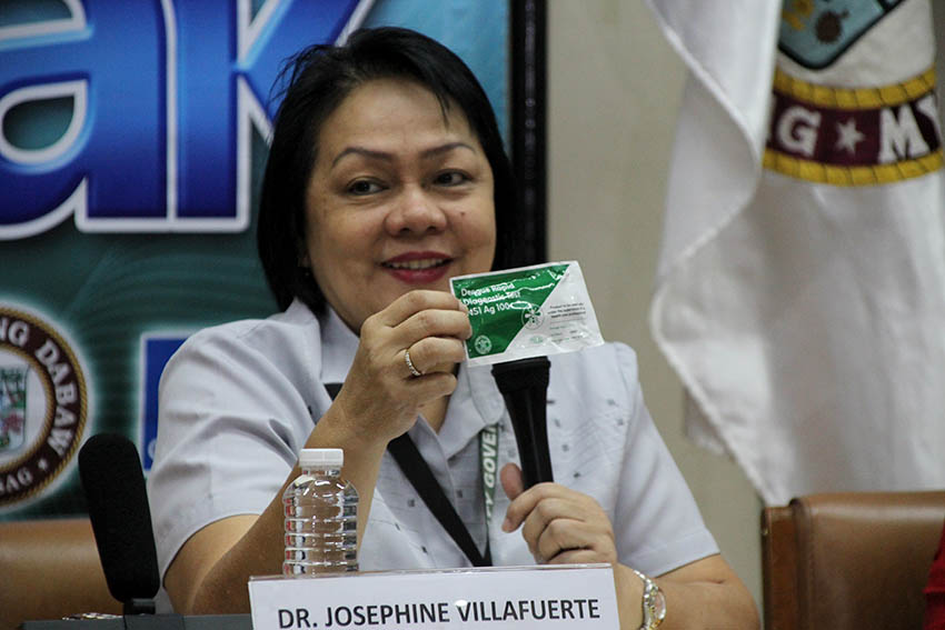 Dr. Josephine Villafuerte presents a Dengue Rapid Diagnostic Test which can detect low platelet count in the blood in a minute of a person infected with dengue virus on Thursday, January 4. (Paulo C. Rizal/davaotoday.com)