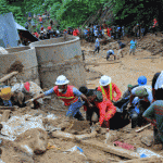 Rescuers carry another body pantukan landslide