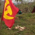 RED FLAG. The flag of the Communist Party of the Philippines (CPP) waves in the wind somewhere in the province of Compostela Valley. The CPP celebrated its 44th founding anniversary Wednesday. (davaotoday.com photo by Ace R. Morandante)