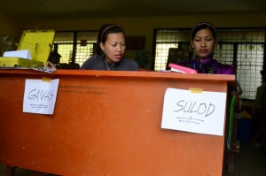 ENTER, EXIT. Voting center in Salapawan Elementary School, Paquibato District. (davaotoday.com photo by Earl O. Condeza)