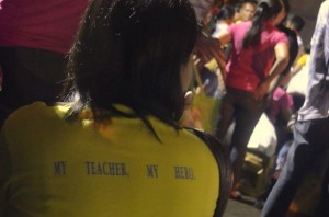 TIRED HERO. The motto in this teacher's shirt is an understatement to her ordeal of waiting whole night to deliver the ballot boxes to the Comelec officers. (davaotoday.com photo by Tyrone A. Velez)