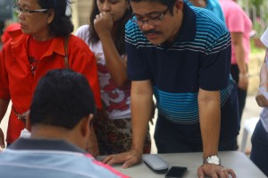 COMING TO VOTE. Bayan Muna Partylist Rep. Carlos Zarate flies in from Manila to vote in his precinct in Matina Elementary School, saying choosing barangay officials matter as they are in the frontlines for residents 24/7. (davaotoday.com photo by John Rizle L. Saligumba)