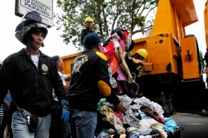 Ukay-ukay clothes get carted away by the city's demolition team operation along City Hall Drive. (davaotoday.com photo by Medel V. Hernani)