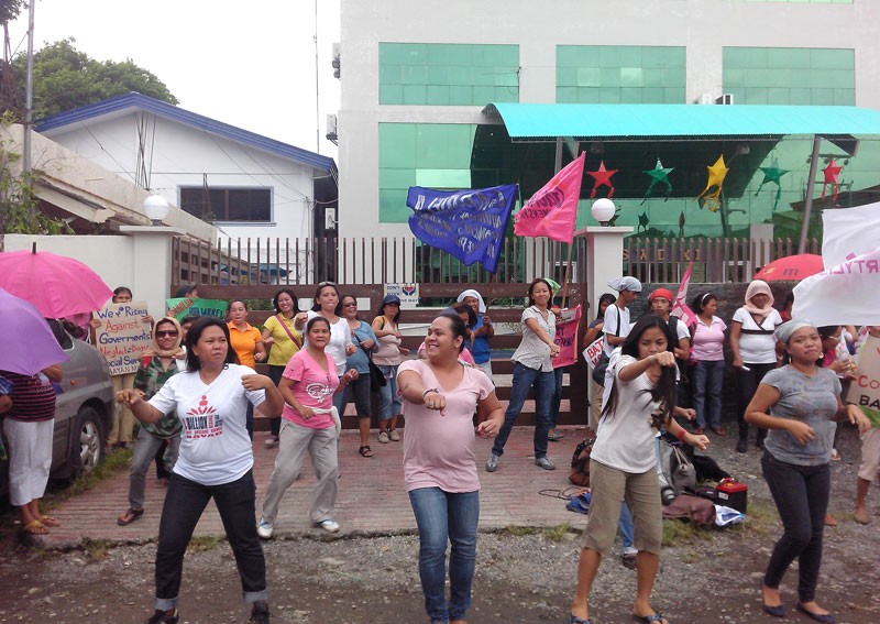 Women dance to protest premium hikes