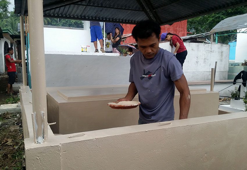 MAN REPAINTS FAMILY’S TOMB