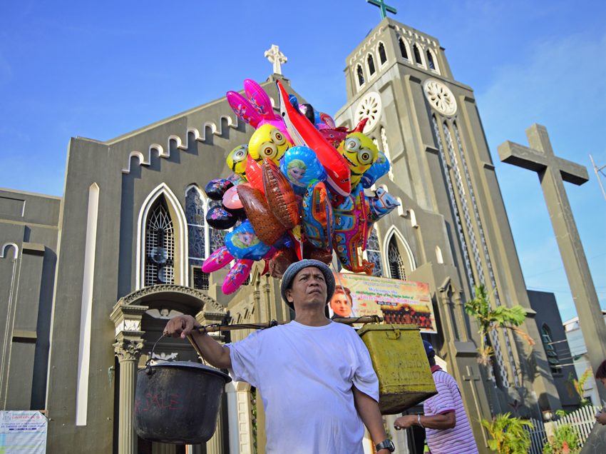 Artist mounts ‘no to vote-buying’ campaign outside church